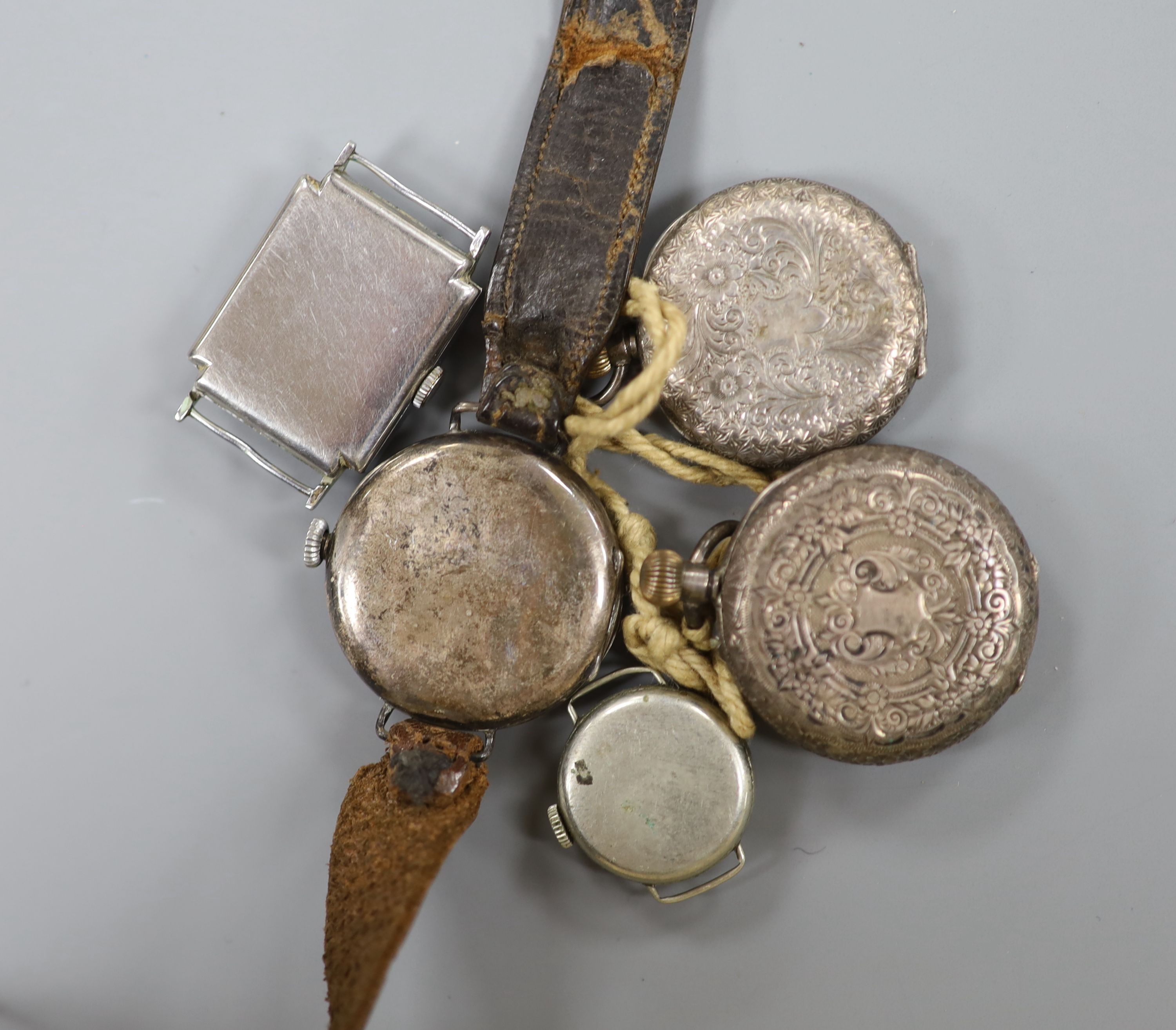 A gentleman's early 20th century silver trench wrist watch by J.W. Benson, four other wrist watches, two silver or white metal fob watches and a wrist watch case.